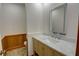 Powder room features wood wainscoting, marble countertop and a lighted mirror at 3352 Northbrook Dr, Atlanta, GA 30340