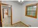 This is a modestly sized bedroom with hardwood floors and view to an adjacent kitchen at 3352 Northbrook Dr, Atlanta, GA 30340