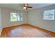 Bright bedroom features wood floors, ceiling fan, and large windows for natural light at 3352 Northbrook Dr, Atlanta, GA 30340
