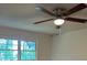 Bedroom features neutral walls, a ceiling fan, and large window at 3352 Northbrook Dr, Atlanta, GA 30340