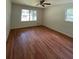 Bedroom with refinished hardwood flooring, ceiling fan, and natural light at 3352 Northbrook Dr, Atlanta, GA 30340