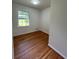 Bedroom features hardwood flooring and a window offering natural light at 3352 Northbrook Dr, Atlanta, GA 30340