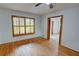 Bedroom with gleaming hardwood floors, white walls and shuttered window at 3352 Northbrook Dr, Atlanta, GA 30340