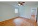Bedroom featuring hardwood floors, white walls, a closet, and a ceiling fan at 3352 Northbrook Dr, Atlanta, GA 30340