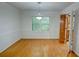 Bright dining room with a hardwood floor, light fixture and window to the yard at 3352 Northbrook Dr, Atlanta, GA 30340
