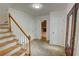 Foyer with slate tile, wooden staircase, and views to the living room at 3352 Northbrook Dr, Atlanta, GA 30340