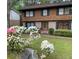 Charming two-story home with well-maintained lawn, blossoming azaleas and a welcoming front entrance at 3352 Northbrook Dr, Atlanta, GA 30340