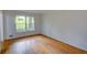 Bright living room features hardwood floors and a large window overlooking the front yard at 3352 Northbrook Dr, Atlanta, GA 30340
