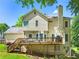 Expansive backyard showcases a lovely deck perfect for entertaining guests and enjoying the outdoors at 3977 Fox Glen Dr, Woodstock, GA 30189