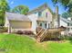 Landscaped backyard featuring a well-maintained lawn and a spacious deck, perfect for outdoor living at 3977 Fox Glen Dr, Woodstock, GA 30189