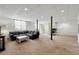 Spacious carpeted basement featuring a comfortable seating area and natural light at 3977 Fox Glen Dr, Woodstock, GA 30189