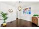 Elegant dining room with hardwood floors, decorative lighting, and stylish decor at 3977 Fox Glen Dr, Woodstock, GA 30189