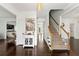 Elegant foyer with hardwood floors, a staircase, and views into adjacent rooms at 3977 Fox Glen Dr, Woodstock, GA 30189