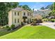 Attractive two-story home with a well-kept lawn and a convenient two-car garage at 3977 Fox Glen Dr, Woodstock, GA 30189