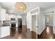 Open kitchen design leading to the home's entryway and featuring stainless appliances at 3977 Fox Glen Dr, Woodstock, GA 30189