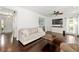 Comfortable living room showcasing hardwood floors and access to the front entry at 3977 Fox Glen Dr, Woodstock, GA 30189