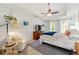 Serene main bedroom with tray ceiling, fan, windows, sitting area, and ample light at 3977 Fox Glen Dr, Woodstock, GA 30189
