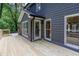 Back of house with wooden deck and access to the backyard from the back door at 4806 Deer Chase, Powder Springs, GA 30127