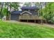 Two story home features a wooden deck, lush yard and private wooded area at 4806 Deer Chase, Powder Springs, GA 30127