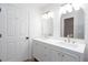 Bright bathroom featuring a double vanity with white countertops and brushed gold hardware at 4806 Deer Chase, Powder Springs, GA 30127