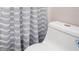 Bathroom featuring gray and white shower curtain and toilet at 4806 Deer Chase, Powder Springs, GA 30127