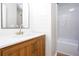 Stylish bathroom featuring a wood vanity with white countertops and a glass-enclosed shower at 4806 Deer Chase, Powder Springs, GA 30127