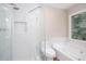 Bathroom featuring a shower, soaking tub, and window at 4806 Deer Chase, Powder Springs, GA 30127
