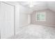 Vaulted ceiling bedroom features plush carpet, and a window provides natural light at 4806 Deer Chase, Powder Springs, GA 30127