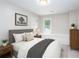 Cozy bedroom featuring a window seat, a picture window, and neutral tones at 4806 Deer Chase, Powder Springs, GA 30127