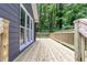 Spacious wooden deck overlooks a private, wooded backyard at 4806 Deer Chase, Powder Springs, GA 30127