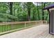 Enjoy outdoor living on this wood deck overlooking a lush backyard at 4806 Deer Chase, Powder Springs, GA 30127