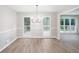 Bright dining room with windows view of deck and outdoor scenery with new floors at 4806 Deer Chase, Powder Springs, GA 30127