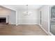 Bright dining room features new floors, elegant lighting, and a view of the outdoor deck at 4806 Deer Chase, Powder Springs, GA 30127