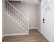Bright entryway with a staircase and light wood floors leading into the house at 4806 Deer Chase, Powder Springs, GA 30127