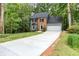 Beautifully landscaped home with a well-maintained front lawn and long driveway at 4806 Deer Chase, Powder Springs, GA 30127