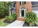 Close-up of the front entrance, showcasing the beautiful door and landscaping at 4806 Deer Chase, Powder Springs, GA 30127