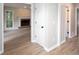 Inviting hallway, showcasing a brick fireplace and updated flooring throughout at 4806 Deer Chase, Powder Springs, GA 30127