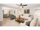 Open-concept living area featuring modern furnishings, a ceiling fan, and abundant natural light at 4806 Deer Chase, Powder Springs, GA 30127