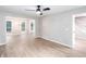 Spacious living room with new floors and an open view of the dining room and stairs at 4806 Deer Chase, Powder Springs, GA 30127