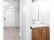 Stylish powder room with modern vanity and direct entry view of front door at 4806 Deer Chase, Powder Springs, GA 30127