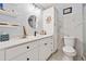 Elegant bathroom with white cabinets, granite countertops, and a marble-tiled wall at 512 Plantation Blvd, Lawrenceville, GA 30046