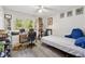 Bright bedroom with large window offering an abundance of natural light and backyard views at 512 Plantation Blvd, Lawrenceville, GA 30046