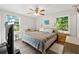 Charming bedroom with natural light, ceiling fan and ample closet space for optimal storage at 512 Plantation Blvd, Lawrenceville, GA 30046