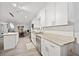 Well-lit kitchen with white cabinets, stainless steel appliances, and granite countertops at 512 Plantation Blvd, Lawrenceville, GA 30046