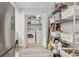 Efficient laundry room with washer, dryer, shelving and plenty of room for storage and organization at 512 Plantation Blvd, Lawrenceville, GA 30046