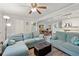 Inviting living room featuring an open concept layout and views of the modern kitchen at 512 Plantation Blvd, Lawrenceville, GA 30046