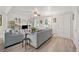 Open-concept living room with neutral decor and a large window that floods the room with natural light at 512 Plantation Blvd, Lawrenceville, GA 30046