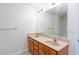 Bathroom featuring double sinks, a large mirror, and a bathtub with white tiled walls at 529 Ridge View Crossing Xing, Woodstock, GA 30188