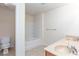 Bright bathroom features a double vanity, toilet and a bathtub with white tile surround at 529 Ridge View Crossing Xing, Woodstock, GA 30188