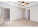 Spacious bedroom featuring access to a balcony, multiple doors and carpet flooring at 529 Ridge View Crossing Xing, Woodstock, GA 30188
